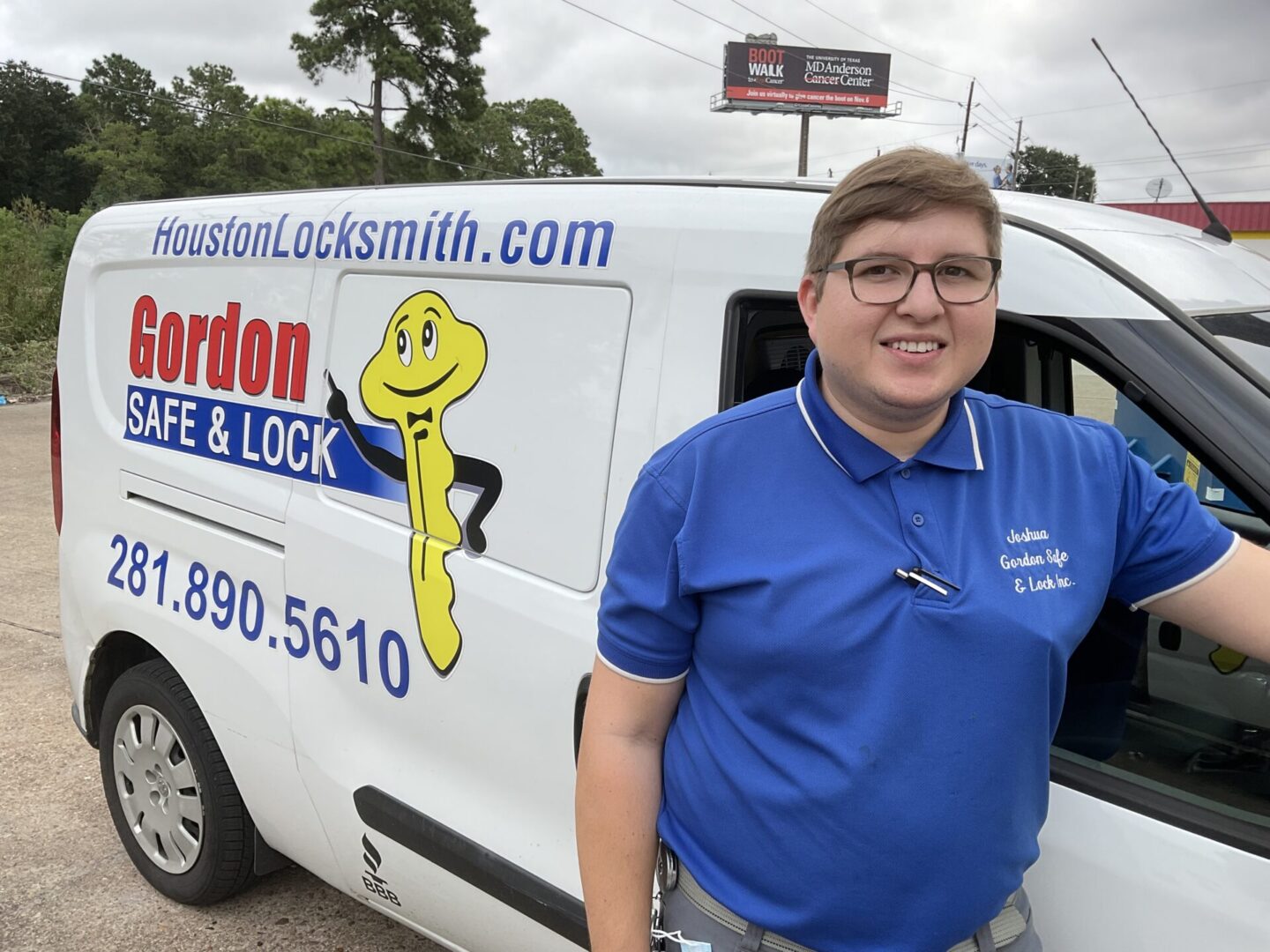 A woman standing in front of a white van.