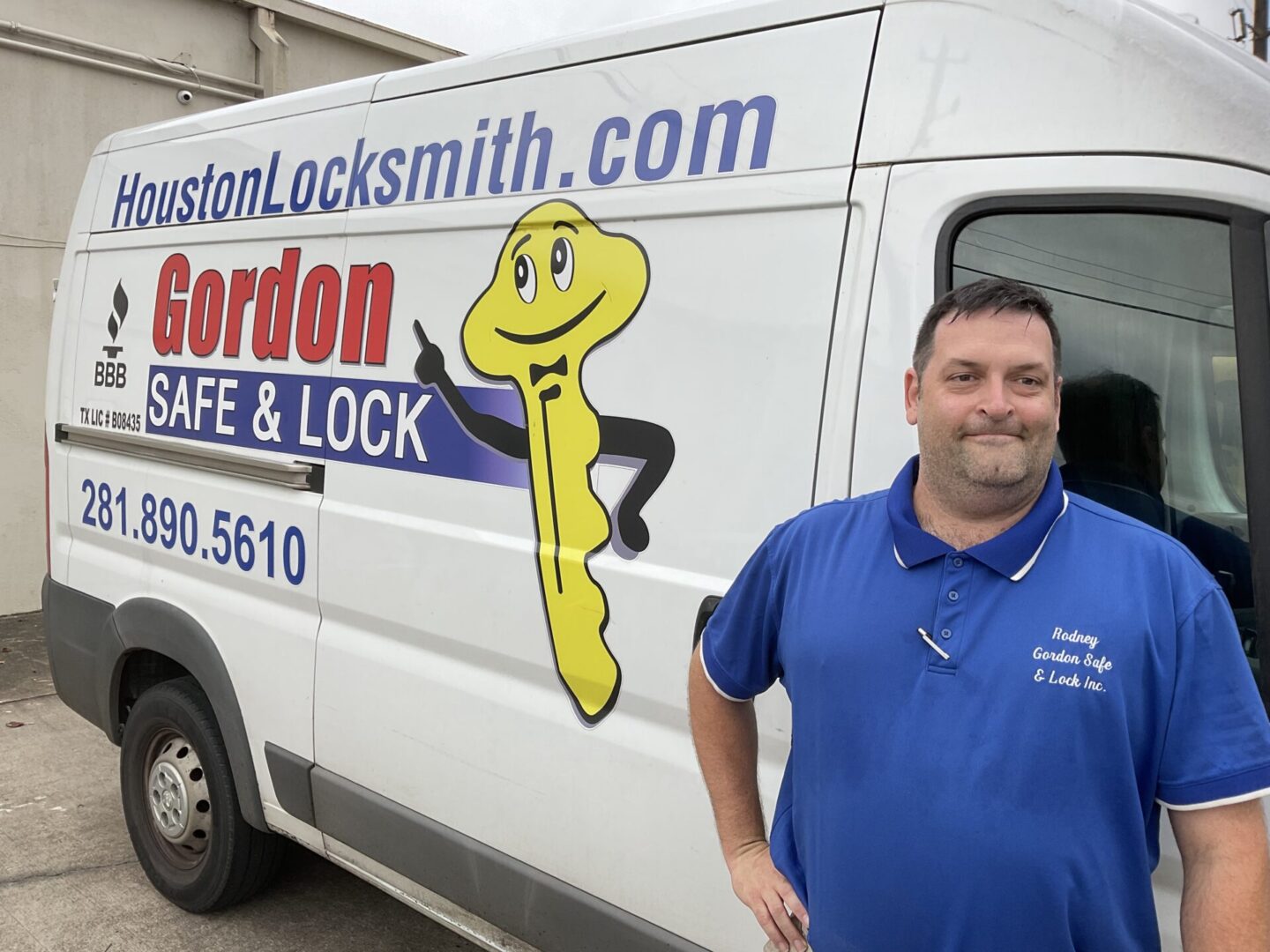 A man standing in front of a white van.